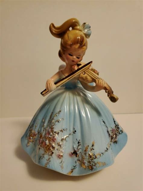 musical porcelain figurines|musical attachment for figurines.